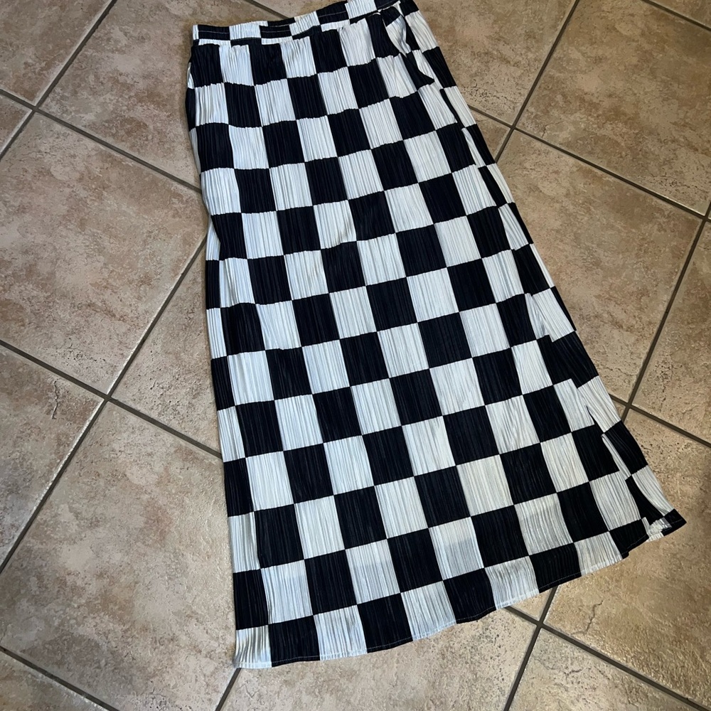 Dressed in LALA Santorini Midi Plisse Skirt in black and white check